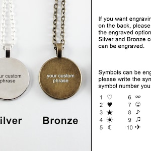 May include: Two round pendant necklaces, one silver and one bronze, each with a chain. The pendants have the text "your custom phrase". Text on the right says engraving options and symbols.