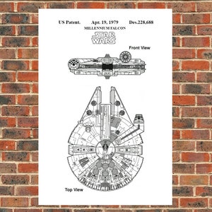 May include: A black and white line drawing of the Millennium Falcon spaceship from Star Wars. The drawing shows the top and front views of the spaceship. The text "US Patent. Apr. 19, 1979 Des.228,688" is at the top of the drawing. The text "MILLENNIUM FALCON" is below the patent information. The text "STAR WARS" is below the spaceship name. The text "Top View" is below the top view of the spaceship. The text "Front View" is below the front view of the spaceship.