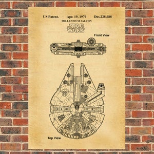 May include: A vintage-style blueprint of the Millennium Falcon spaceship from Star Wars. The blueprint shows the top and front views of the ship, with detailed drawings of its design and features. The text "US Patent. Apr. 19, 1979 Des.228,688 STAR WARS MILLENNIUM FALCON" is printed at the top of the blueprint.