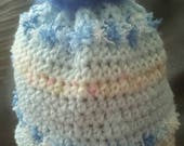 Crochet pretty blue small child girls hat, with blue pom pom cute
