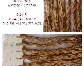 May include: Hand-painted embroidery floss in shades of brown, labeled "Hungarian Pointer" and "DMC 435-436-976-977-3826". The floss is 100% cotton and comes in an 8-meter/8.7-yard skein.
