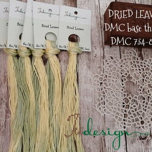 May include: Five skeins of DMC embroidery floss in shades of green and yellow, labeled "Dried Leaves" and "DMC base thread 734-834".