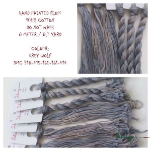 May include: Hand-painted embroidery floss in shades of gray, labeled "Grey Wolf" and "DMC 318-415-160-161-414". The floss is 100% cotton and comes in an 8 meter / 8.7 yard skein. It is labeled "Hand Painted Floss", "100% Cotton", "Do Not Wash", and "8 Meter / 8.7 Yard".