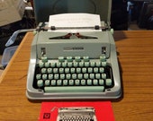 1967 Seafoam Green Hermes 3000 portable typewriter with case lid and instruction manual