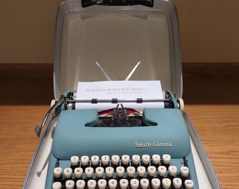 1961 Alpine Blue Smith Corona Sterling portable typewriter with carrying case