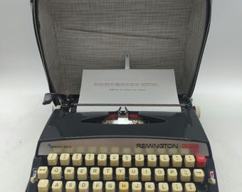 1969 black Remington 333 ultra portable manual typewriter with case