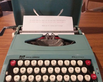 1970's turquoise Smith Corona Skyriter ultra portable typewriter