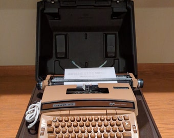 1970's brown Smith Corona Coronet Super 12 electric typewriter with case