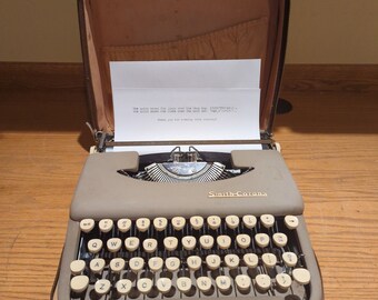 1956 Smith Corona Skyriter ultra portable manual typewriter with carrying case