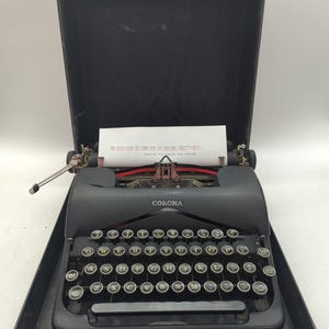 1940 Smith Corona Standard portable manual typewriter with carrying case