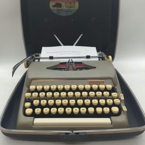 1964 Dawn Gray Smith Corona Classic portable typewriter with case