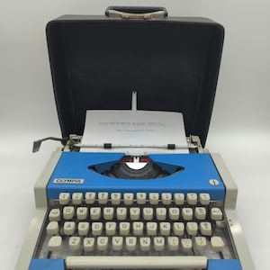 Cursive! 1969 Bright Blue Olympia Traveller portable manual typewriter with script (cursive) typeface!