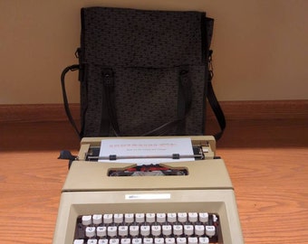 1970's beige Olivetti Lettera 25 portable manual typewriter with carrying bag