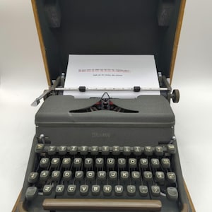 1952 Army Green Hermes 2000 portable typewriter with carrying case