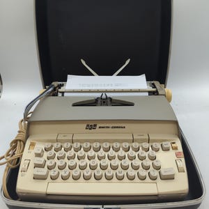 Cursive! 1960&#39;s dawn gray Smith Corona Coronet portable electric typewriter with carrying case - script (cursive) typeface!