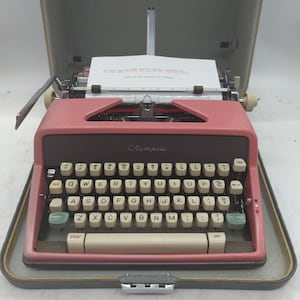 Cursive! 1963 Pink Olympia SM7 portable typewriter with carrying case - script typeface