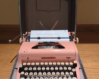 1956 bubble gum pink  Royal Quiet Deluxe portable manual typewriter with carrying case