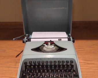 1960's Aqua blue Remington Envoy II ultra portable manual typewriter typewriter