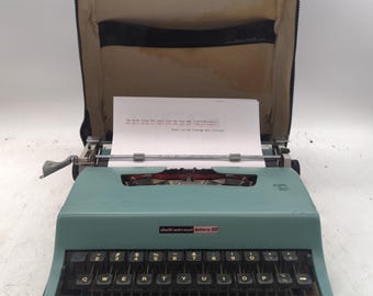 1969 light blue Olivetti Lettera 32 ultra portable manual typewriter with carrying case
