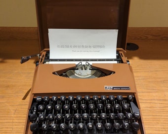 Cursive! 1972 brown Smith Corona Super G ultra portable manual typewriter with script typeface