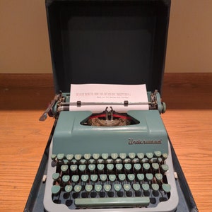 Green and Gray 1955 Underwood Universal Quiet Tab portable manual typewriter with carrying case