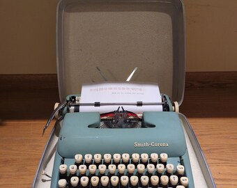 1961 Alpine Blue Smith Corona Sterling portable typewriter with carrying case