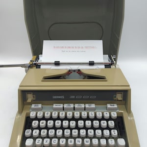 1970 Hermes 3000 portable manual typewriter with with carrying case lid