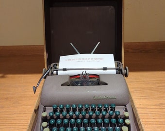 1952 Brown Smith Corona Sterling portable typewriter with carrying case