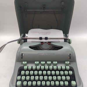 1959 Curvy Hermes 3000 seafoam green portable manual typewriter with carrying case