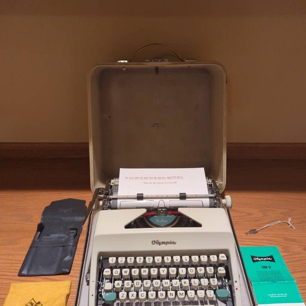 Cursive! 1966 Olympia SM9 portable typewriter with script (cursive) font, owner's manual, cleaning kit, case, and key!