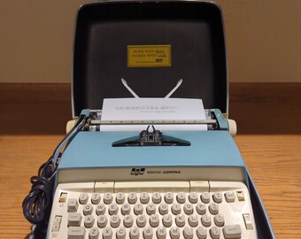 Cursive! 1960's Blue Smith Corona Coronet portable electric typewriter with carrying case - script (cursive) typeface!