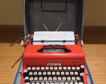 1957 Cherry Red Royal Quiet Deluxe portable manual typewriter with carrying case