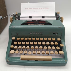 1955 Green Royal Quiet Deluxe portable manual typewriter with case