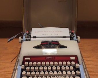 1961 Red, White, and Blue Royal Futura 800 portable typewriter with case - curvy!