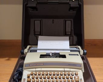 1970's brown Smith Corona DeVille electric portable typewriter with case