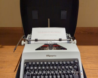 Cursive! 1969 Olympia SM8 working portable typewriter with carrying case - script typeface