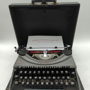 1953 Gray Oliver portable manual typewriter with carrying case