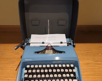 1960's blue Remington Personal-Riter portable typewriter with case