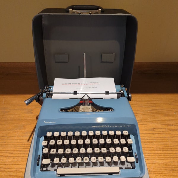 1960's blue Remington Personal-Riter portable typewriter with case