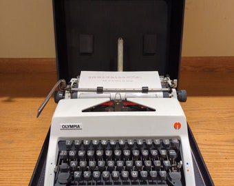 1978 Olympia SM9 portable manual typewriter with carrying case