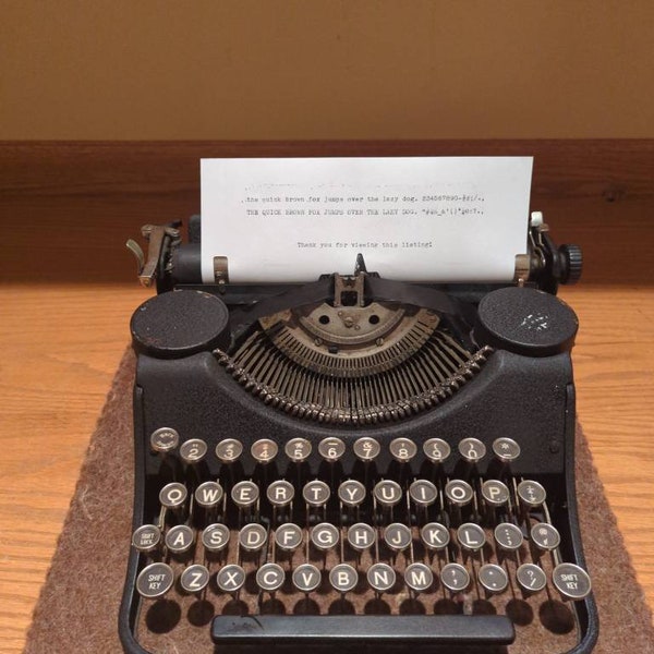 1938 black Underwood Leader manual portable typewriter with typing pad