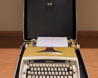 1963 Goldenrod Mustard Yellow Royal Safari Deluxe portable typewriter with case