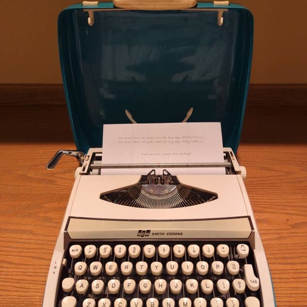 Cursive! 1970's cream and teal Smith Corona Cougar Deluxe ultra portable typewriter with script font!