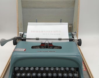 Spanish keyboard! 1961 Olivetti Studio 44 portable manual typewriter with case