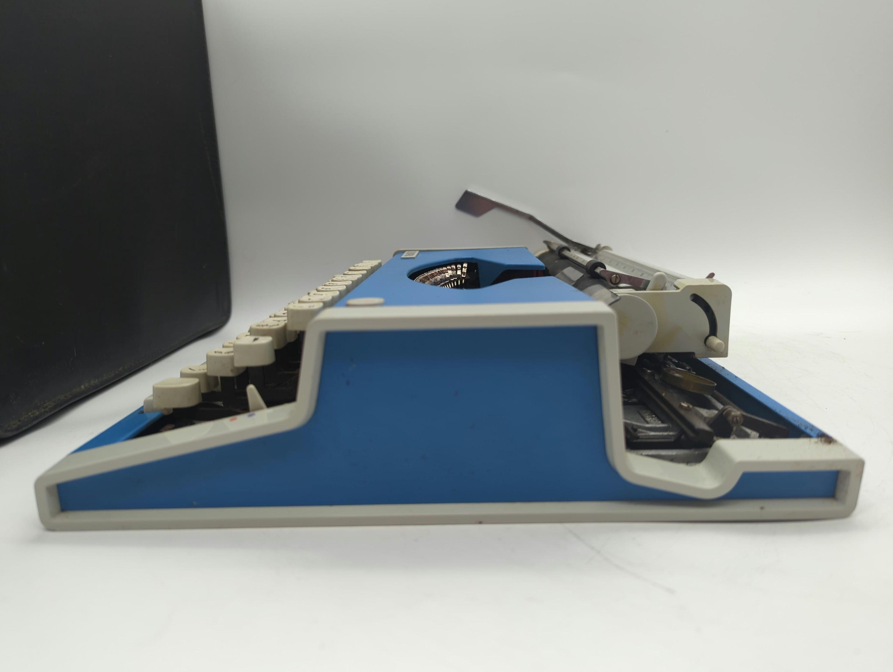 Cursive! 1969 Bright Blue Olympia Traveller portable manual