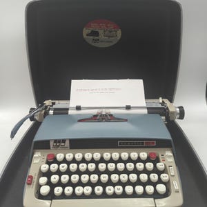 Techno! 1966 Blue Smith Corona Classic 12 portable typewriter carrying case with classic elite typeface