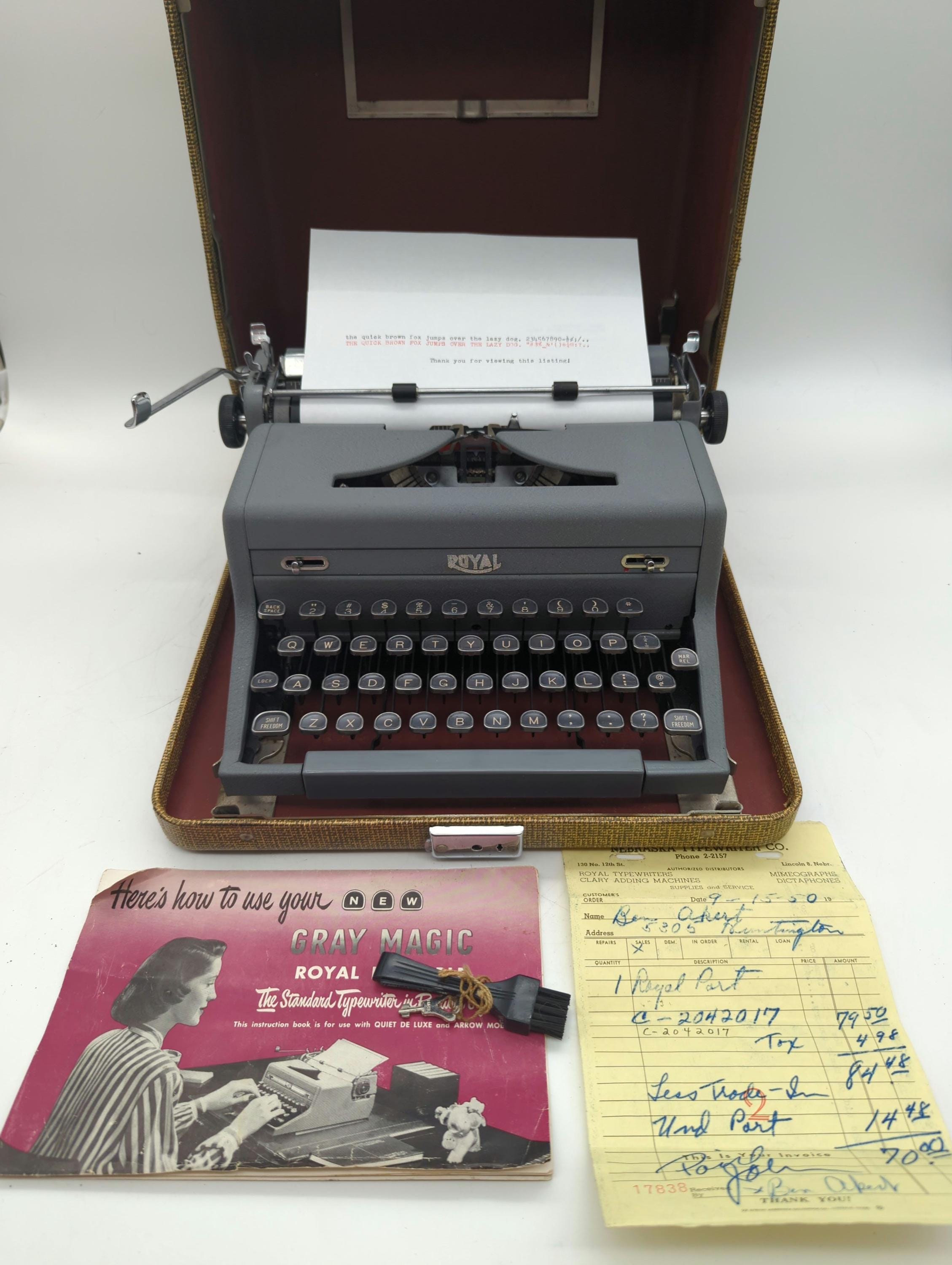1950 Gray Royal Arrow portable manual typewriter with carrying case, owner's manual, key, cleaning brush, and original sales receipt