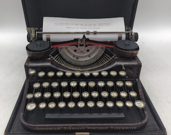 1928 red wood patterned Underwood 4 bank portable manual typewriter with case