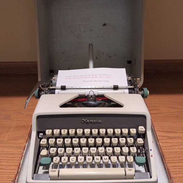 Cursive! 1961 white Olympia SM7 portable typewriter with carrying case - script typeface