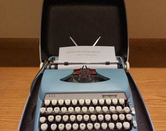 1963 Starmist Blue Smith Corona Sterling portable typewriter with carrying case